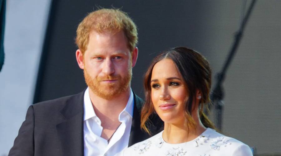 Prince Harry and Meghan with families at the Lost Screen Memorial display of illuminated phone screens in NYC.