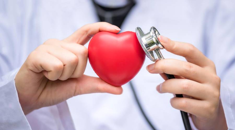Doctor reviewing cardiac MRI scan results to estimate patient’s heart age