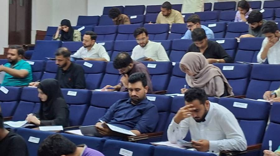 Candidates appearing for PMDC NRE-I 2025 licensing exam held across Pakistan under NUMS