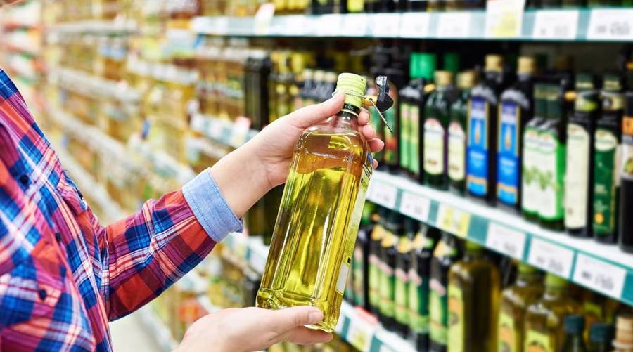 person cooking with vegetable oil rich in omega-6 linoleic acid, which may help reduce heart disease and diabetes risk