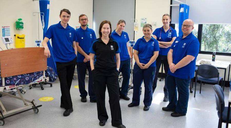 UOW clinical simulation lab with students using high-tech nursing and healthcare training equipment