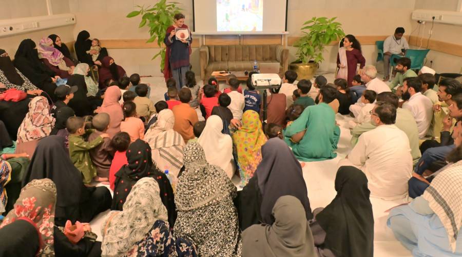 Storytelling session at SIUT Children’s Hospital with young patients, caregivers, and GoRead.pk