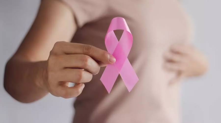 OneTouch-PAT system scanning a breast for cancer using AI-enhanced photoacoustic and ultrasound imaging