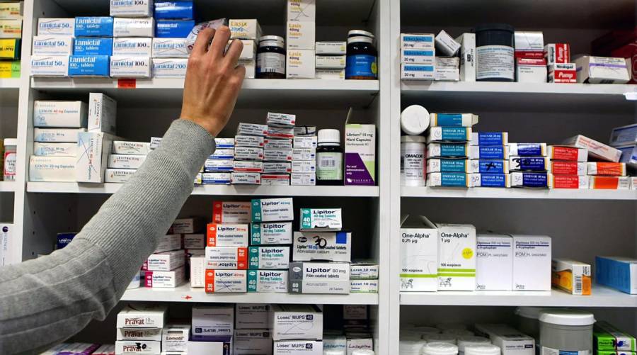 Long shot of medicine shelves in a pharmacy highlighting rising drug prices in Pakistan after de-control policy.