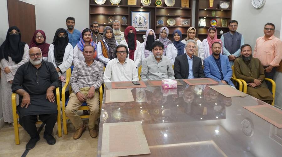 Hamdard University doctors conducting free hijama therapy and herbal medicine consultations at Karachi Press Club eastern medicine camp.