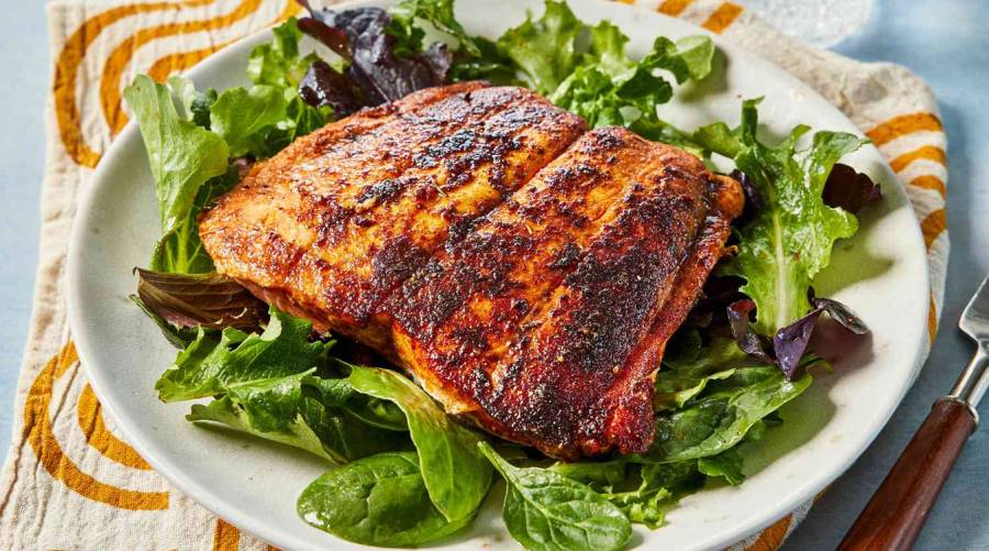 Experts clarify whether daily salmon intake protects the heart or raises cholesterol.