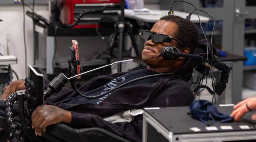 Phillip McKenzie, who was paralyzed from the neck down in a fall in 2012, uses a brain-computer interface developed by researchers at the University of Pittsburgh to navigate complex virtual tasks that simulate everyday activities.