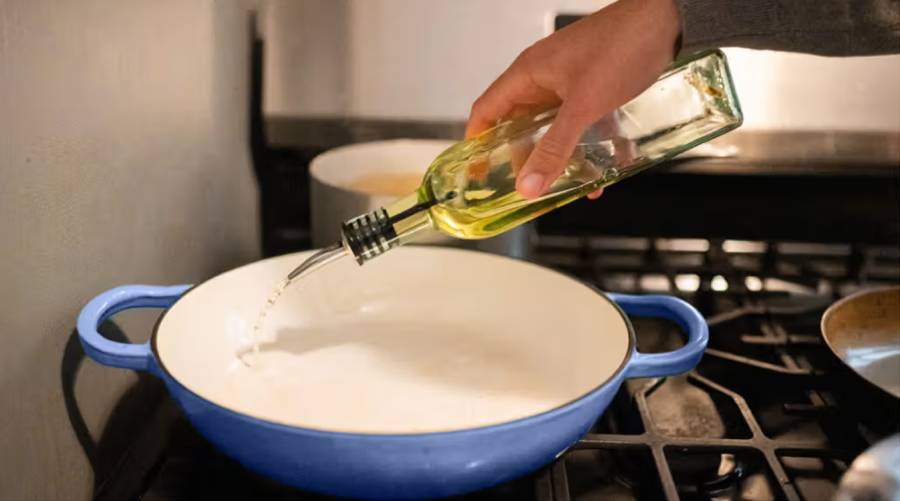 A bottle of soybean oil on a kitchen counter highlighting concerns about linoleic acid and obesity risk.
