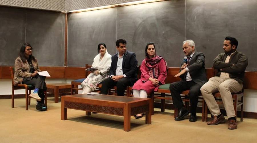 Experts on stage during a seminar discussing the role of clean water in tackling child malnutrition in Sindh, Pakistan.