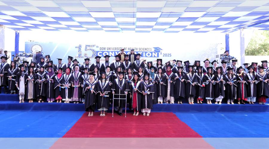 A wide view of the DUHS 15th Convocation ceremony at Ojha Campus Cricket Ground, highlighting graduating medical and dental students and the strong presence of female medalists.