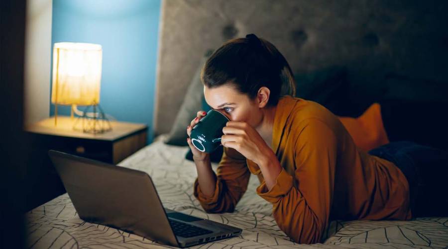 Person looking at clock at night, illustrating night owl chronotype and heart health risk