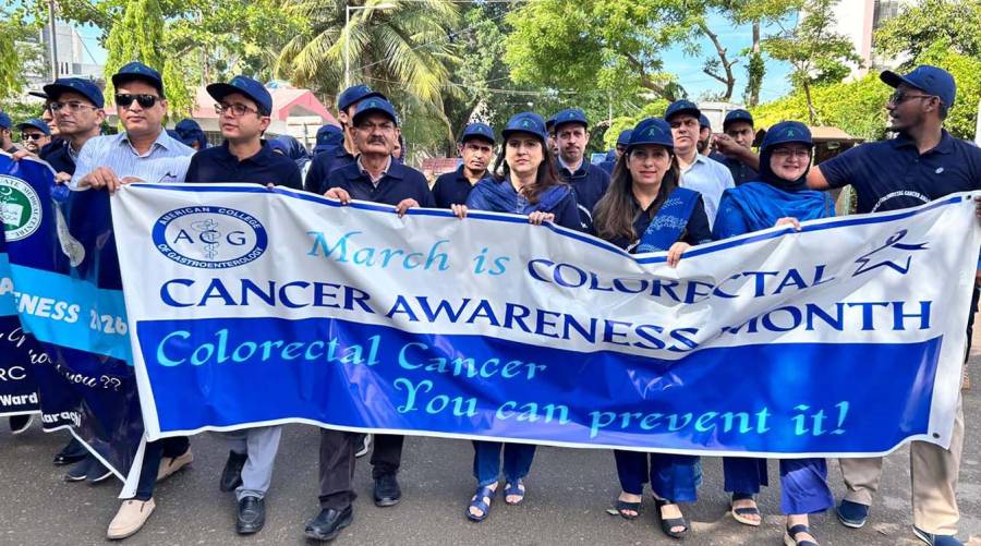 Colorectal cancer awareness rally by JSMU and JPMC in Karachi with students, faculty, and medical staff.