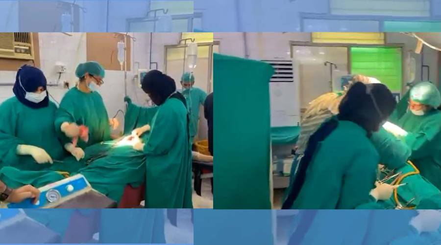 Doctors performing C-section surgery in hospital operating theatre amid controversy over viral video in Lahore