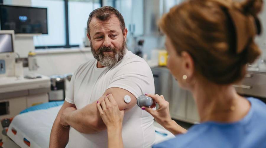 A person exercising and preparing healthy food as experts highlight lifestyle changes to reduce chronic disease risks associated with prediabetes.