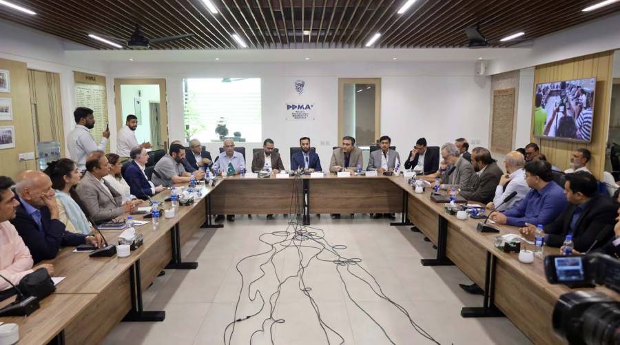 Federal Health Minister Syed Mustafa Kamal speaking at a meeting with pharmaceutical industry representatives while announcing Pakistan's upcoming barcode and QR code medicine verification system.