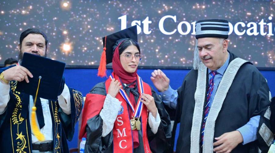 Graduating MBBS students celebrate during the first convocation of Sialkot Medical College as UHS Vice Chancellor Prof. Dr. Ahsan Waheed Rathore confers degrees.
