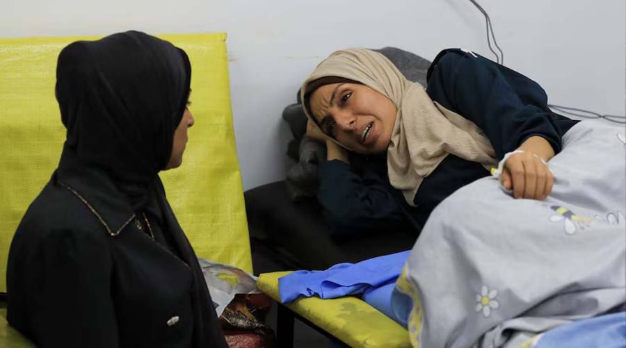 Palestinian cancer patient Elham Al-Sakafi, 38, reacts as she speaks to a relative after stopping chemotherapy because it was unavailable in Gaza, at Al-Shifa Hospital in Gaza City, August 6, 2026.