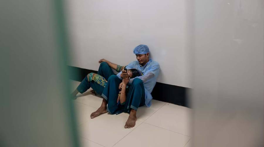 Iqbal and Sharmin wait as their five-month-old son, Esa, receives treatment for measles in the neonatal intensive care unit of a hospital in Narayanganj, Bangladesh, May 11, 2026.